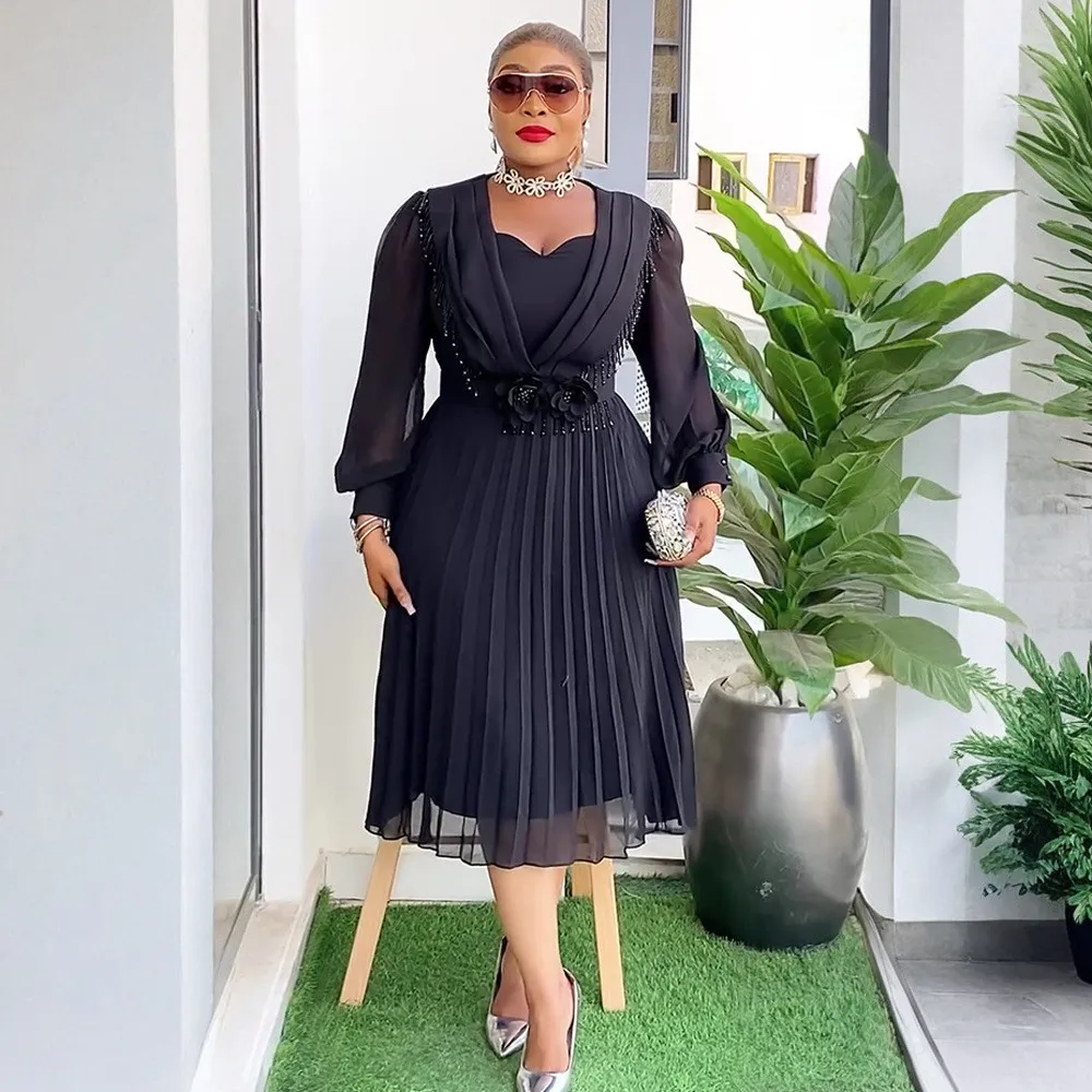 Robe trapèze plissée en mousseline de soie à taille fine et chic